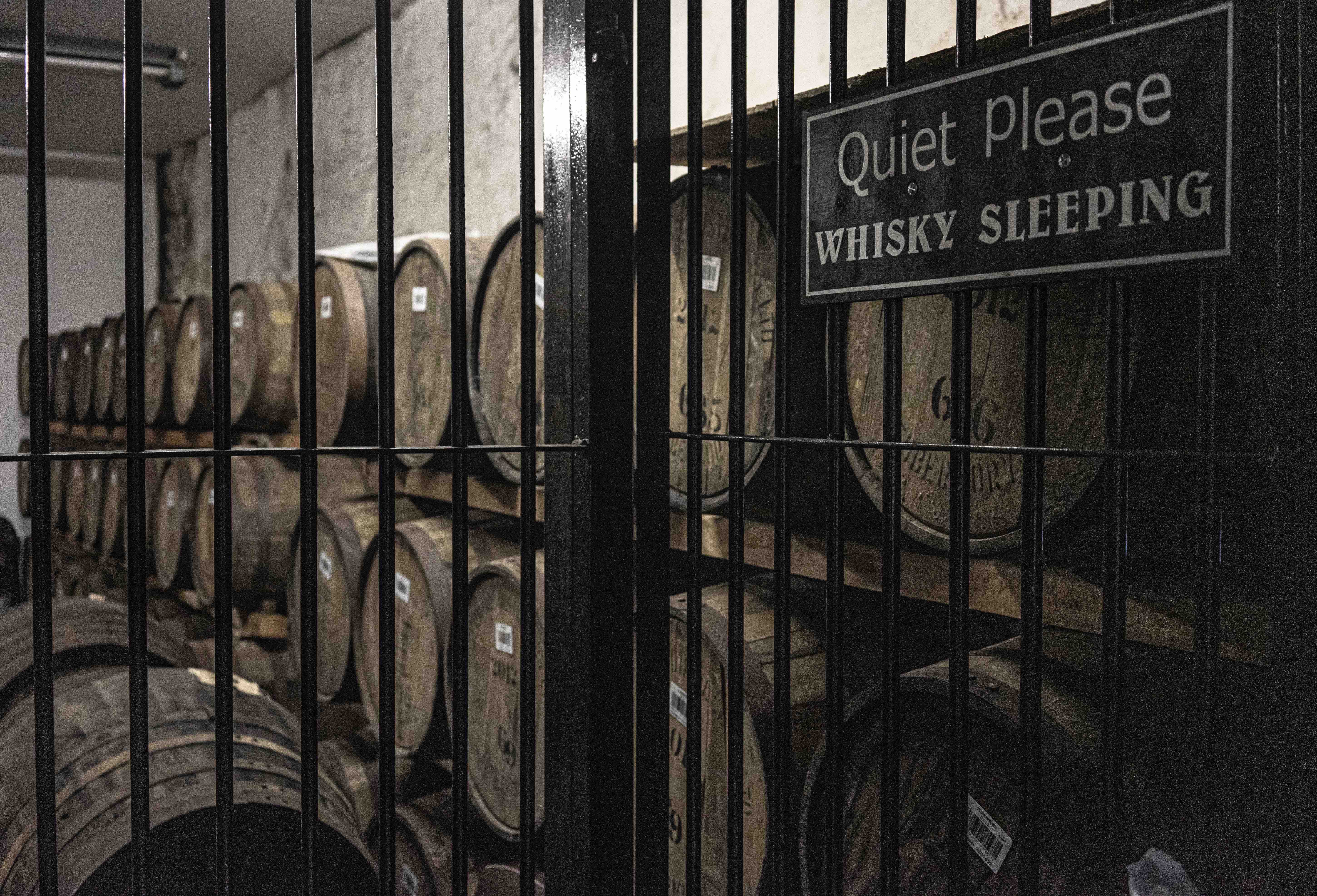Atmospheric whisky warehouse with aged casks