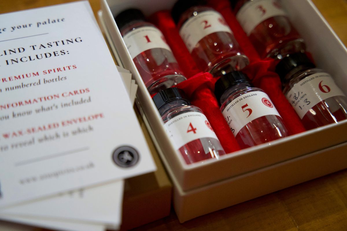 Blind tasting guide and numbered bottles in London gin gift box